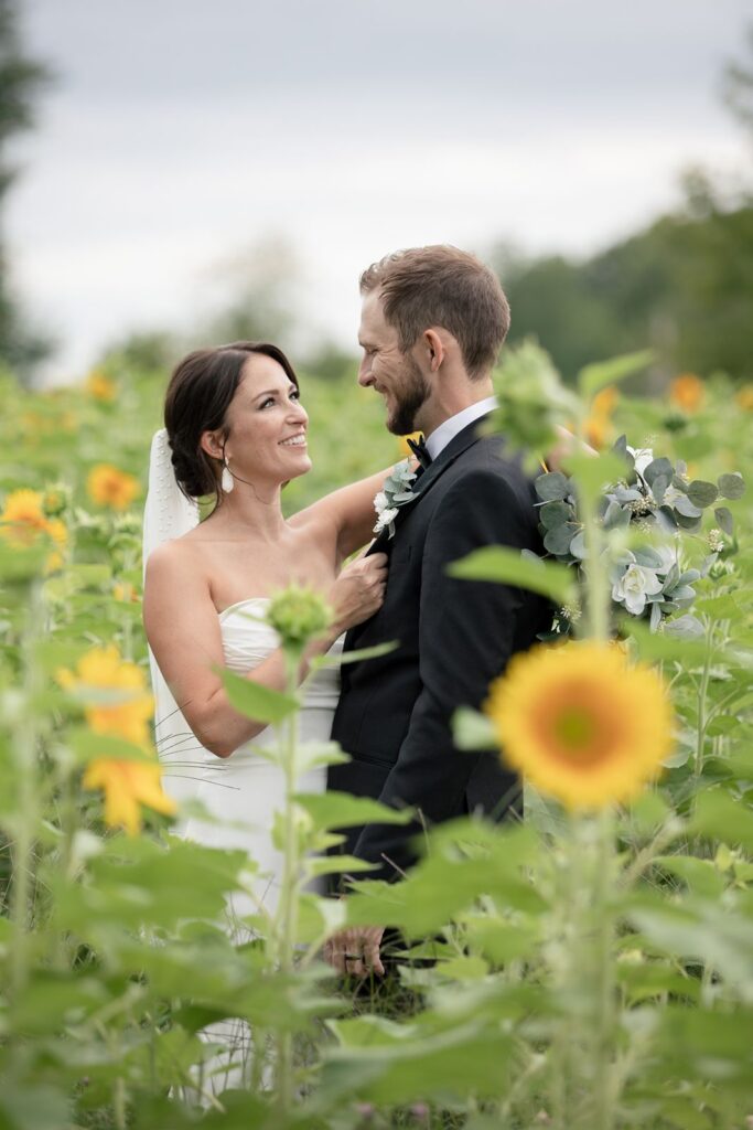 bride and groom in sunflower field tabor hill weddings
