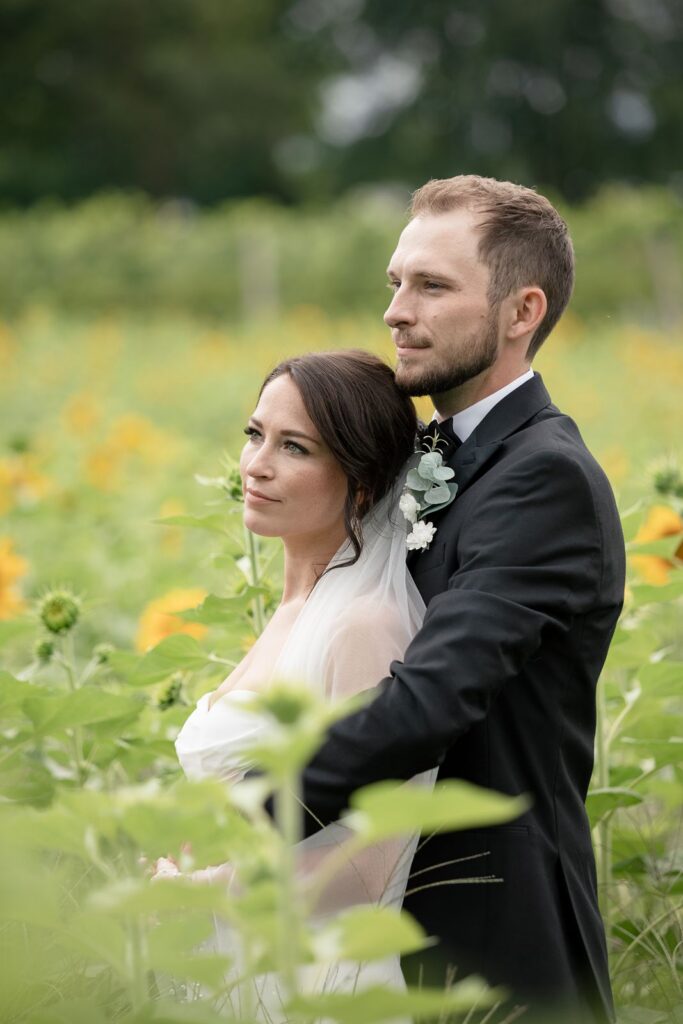 bride and groom in sunflower field tabor hill weddings
