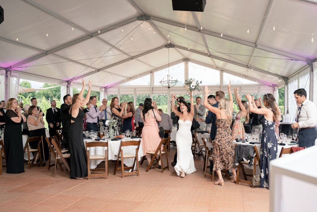 Bride and Groom grand entrance at tabor hill weddings tented reception