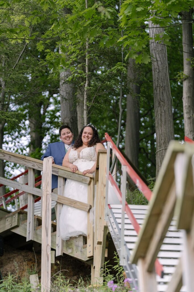 stairs down to beach wedding couple at Lake michigan elopement venue rental lake house saugatuck