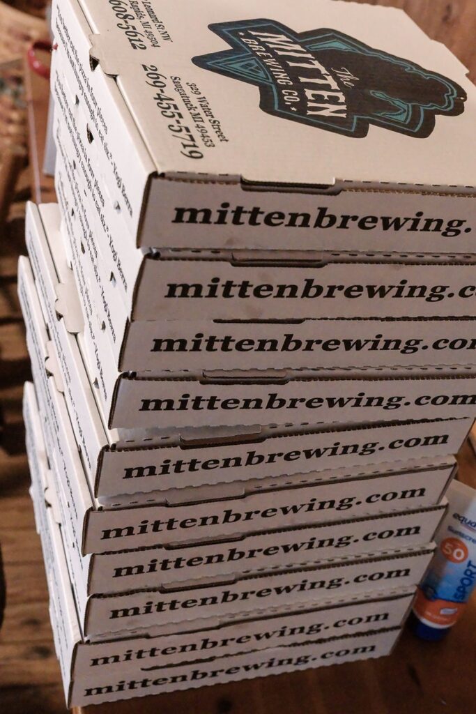 8 Mitten Brewing Company Pizza Boxes catered pizza for saugatuck lake michigan elopement